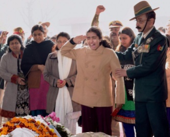 New Delhi: The daughter of Col MN Rai cries as she salutes to pay her last respect to his mortal remains during his cremation in the Delhi Cantt on Thursday. Rai was killed in a gunbattle with militants in south Kashmirs Pulwama district on Tuesday. PTI Photo by Manvender Vashist (PTI1_29_2015_000053B)
